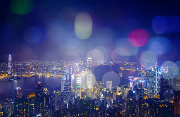 istock Abstract bokeh light with Hong Kong City night view background; Double Exposure 1903282564