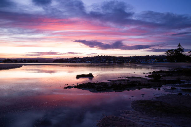 istock The water of a channel reflects a beautiful ocean sunset 1903282954