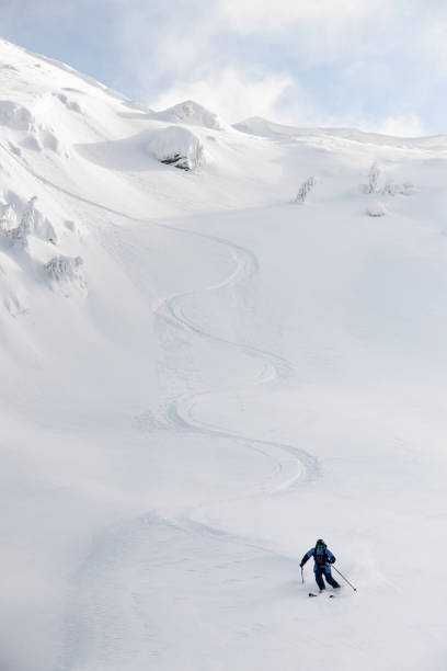 istock Great view on snowboarder riding down the untouched powder snow. 1903293186