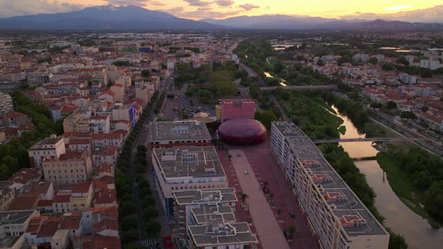 Establishing shot of french city of Perpignan is located on the seashore. Aerial view of the central area of a tourist city in summer. Drone view of the southern city of France. Center of city
