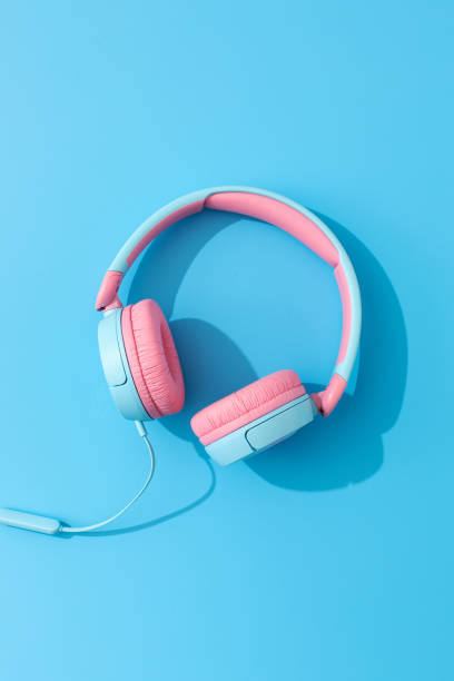 istock Bright wired headphones on a blue background. Music and technology. 1903382842