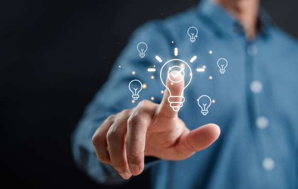 istock Hand man holding illuminated lightbulb, idea, innovation and inspiration with glowing virtual brain, smart intelligent creativity with bulbs, Motivation and innovation concept. 1903432322