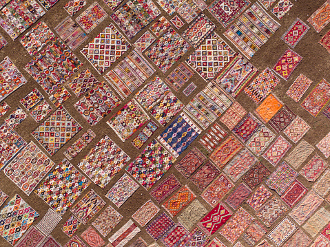 Aerial view of colourful carpets  under sunlight for accelerated ageing. Taken via drone. Antalya, Turkey.