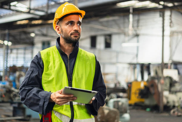 istock engineer look projects and planning with tablet mobile in factory 1903475827
