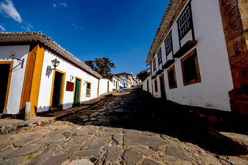 Streets of cobblestone and old historical houses in colonial style on the streets of the old and historic city of Tiradentes on the state of Minas Gerais, Brazil