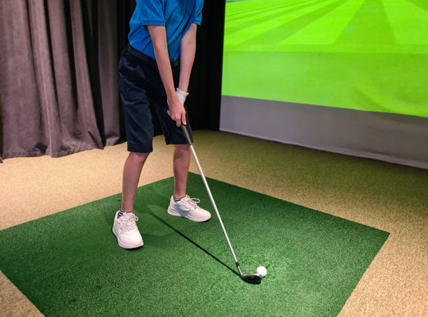 istock Teen guy golfer plays golf on a golf simulator 1903504050
