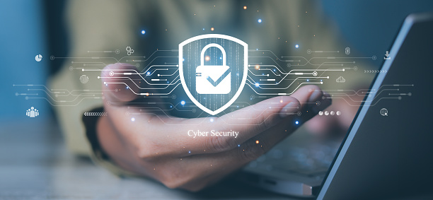 Cyber security and network protection with cybersecurity expert working. Lock icon and internet network security technology on secure access to protect server against cybercrime.