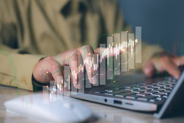 istock Businessman using laptop with forex trading graph financial data. Goal business success strategy chart target and planning. Stock market, financial graph growth report, business development. 1903571818
