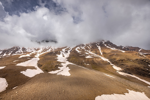 Barren snow covered mountain peaks of the greater Himalayas, en route Manali to Leh, Himachal Pradesh