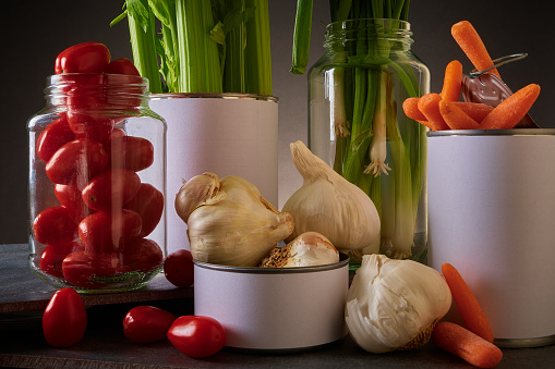 Mixed, fresh vegetables juxtaposed in containers not normally used in Golden, Colorado, United States