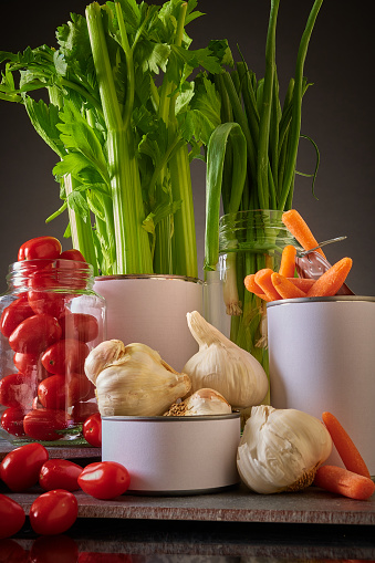 Mixed, fresh vegetables juxtaposed in containers not normally used in Golden, Colorado, United States