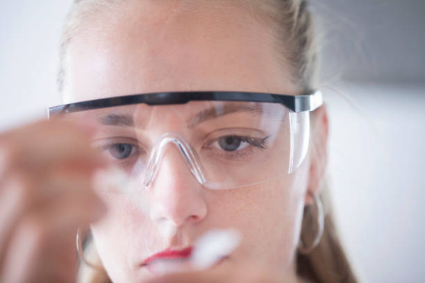 istock young scientist female with  lab glasses pipetting 1903577651