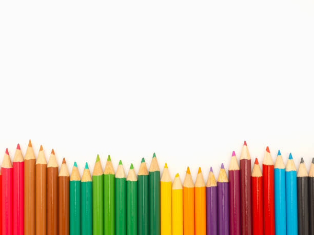 istock Colorful colored pencils on a white background in a creative workspace. 1903592222