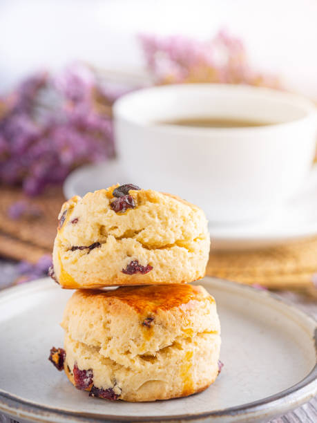 istock Traditional British scones with a white coffee cup and blurred background 1903593255