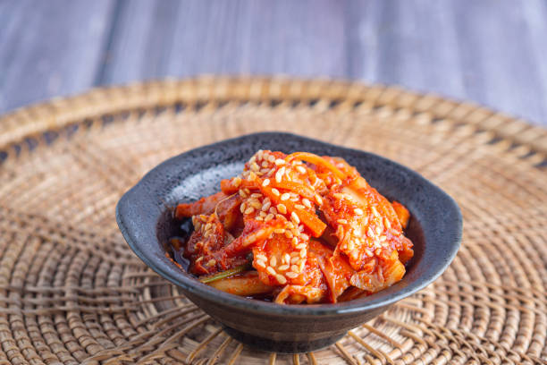 istock Traditional Korean dishes (Kimchi) in a bowl on rattan pacemat. 1903595336