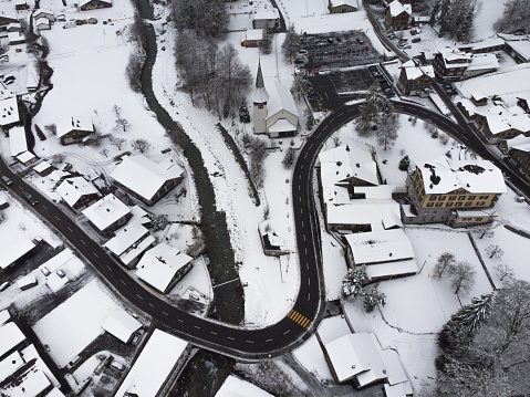 Aerial view of snowy swiss town with river running through it in Lauterbrunnen, Canton of Bern, Switzerland