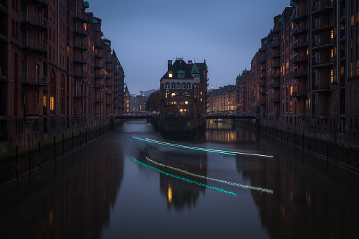 Evening boat light trails at Speicherstadt in Hamburg in Hamburg, Hamburg, Germany