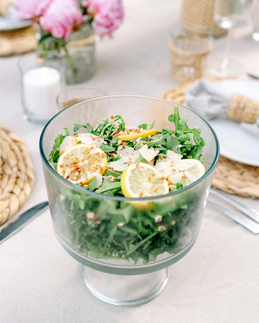 Tablescape with a refreshing summer salad made with lemons and arugula in Seattle, Washington, United States