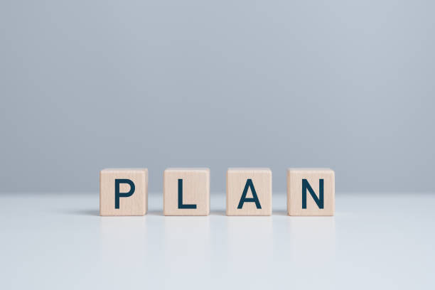 istock Wooden blocks with text PLAN for business strategy and action plan. Targeting and daily planning of business concepts. Business project development effective time planning and management. 1903697623