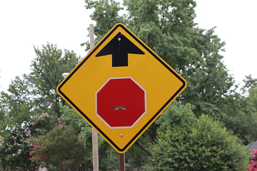 Stop sign ahead with old facial hair that it can’t shave off