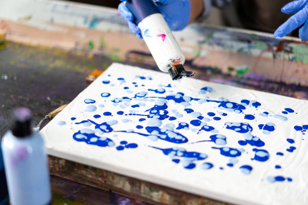 istock 4K Asian senior woman learning acrylic pouring art. 1903731255