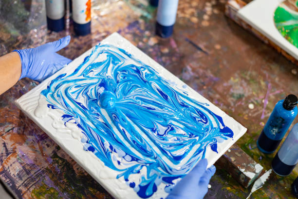 istock 4K Asian senior woman learning acrylic pouring art. 1903731775