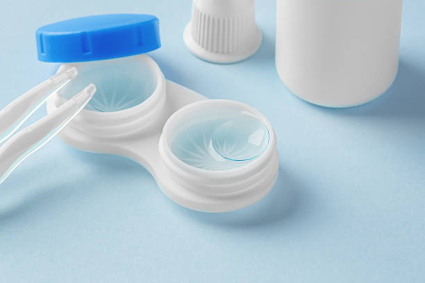 istock Contact lenses in case with solution liquid on blue background, cleaning contact lens concept 1903742009