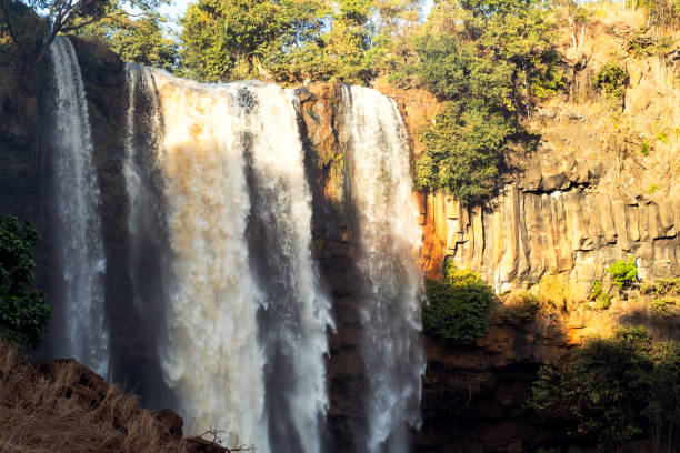 istock Vast majestic waterfall surrounded rainforest, aerial view. 1903745579