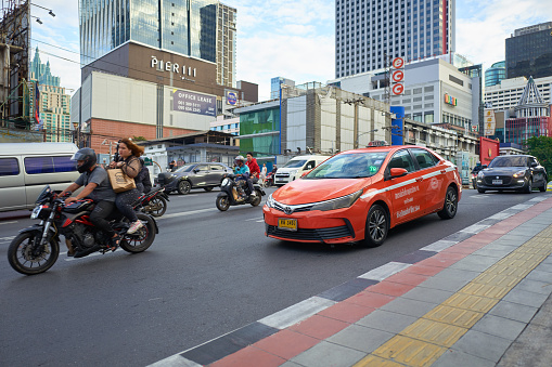 Bangkok, Thailand - Dec 04, 2023: Bangkok Colorful Taxi car on the street. Convenient public transport service in city