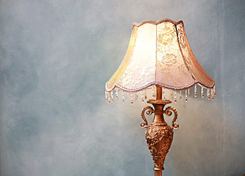 Beautiful classic style lamp, light gray background, space to insert text.