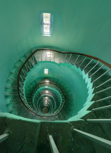 Narrow staircase spiraling down the inside of a Richardson's lighthouse in little Andaman island, India