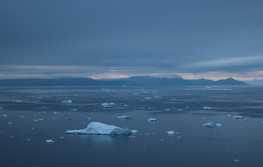 A moody sea and sky sets the scene as we land in Ilulissat, Greenland.