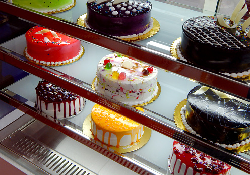 Close-up view of display of cakes in shop display of a bakery shop