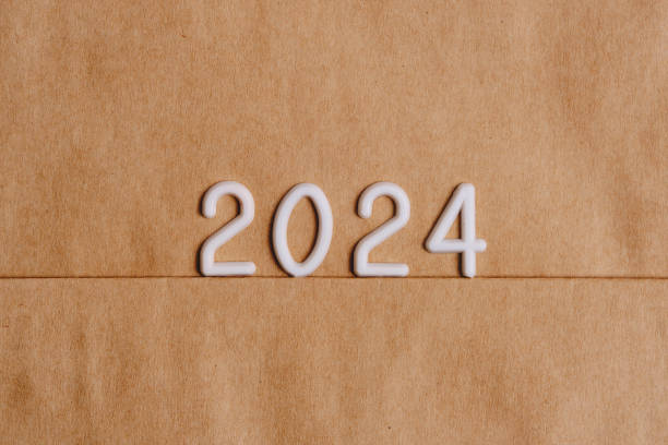 istock Figures for year 2024 on a background of brown paper. 1903917298