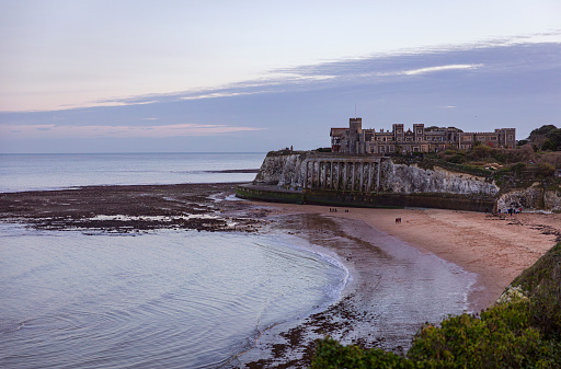 Evening blue hour view over Kingsgate bay and Kingsgate castle on the north east coast of Kent south east England UK