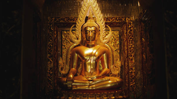 istock Buddha statue with closed eyes in the temple 1903985197