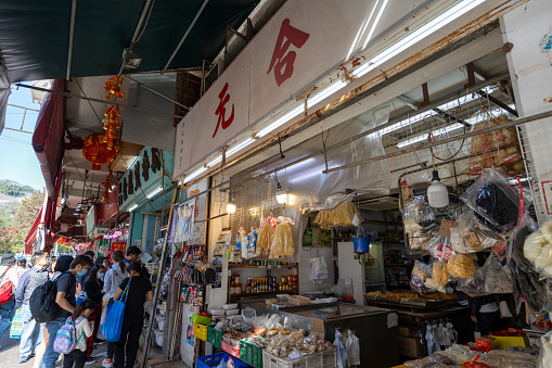 Hong Kong - December 31, 2023 : People at the grocery stores in Nga Tsin Long Road, Kowloon City, Hong Kong.