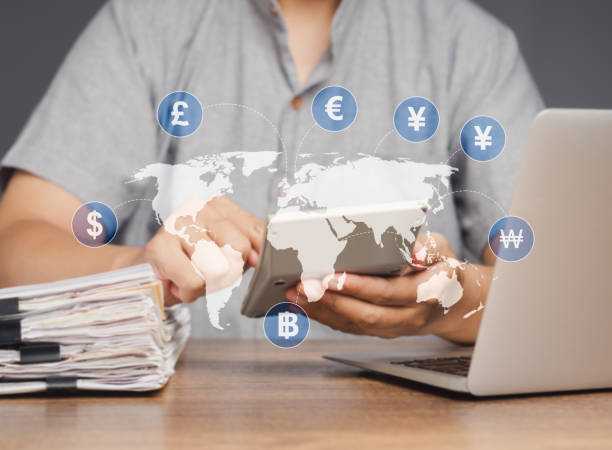istock A businessman uses a calculator to calculate currency exchange. 1904026071