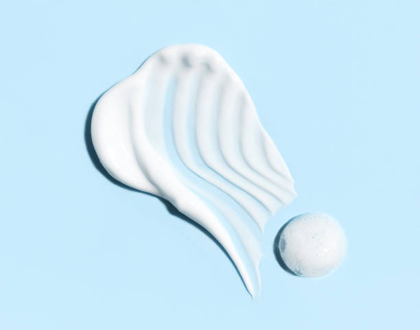 istock cosmetic smears cream texture on blue background 1904032370