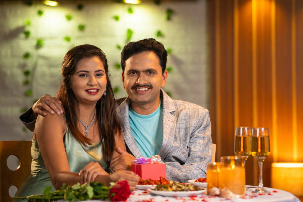 istock portrait shot of Joyful romantic couples at candlelight dinner looking camera at restaurant - concept of valentines day or anniversary celebration and fashionable relationship 1904045182