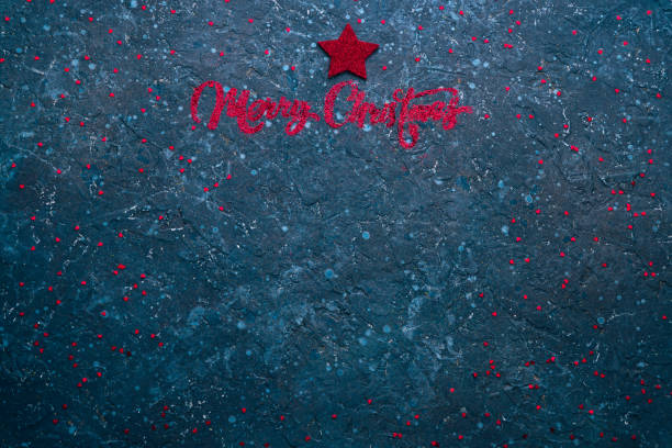 Merry Christmas and Happy New Year textured blue background with copy space for text