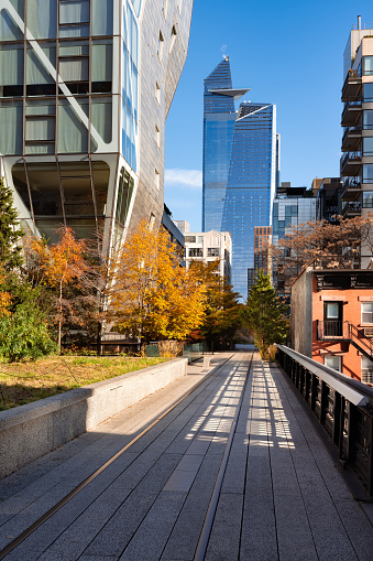 The High Line promenade with Hudson Yards skyscrapers in autumn. Chelsea, Manhattan, New York City