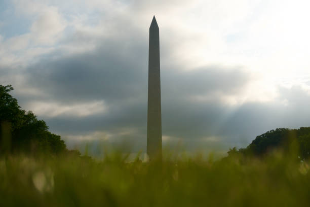 istock Washington Monument Obscured by Clouds and Grass 1904095488