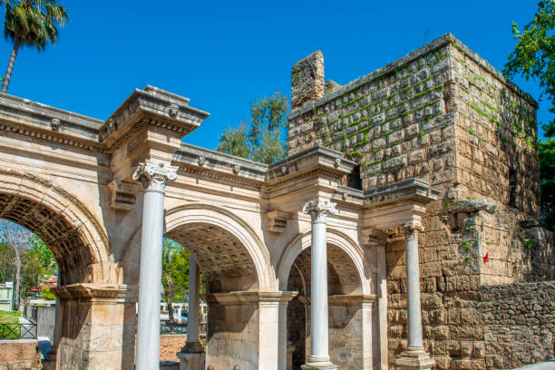 Hadrian's Gate or Three Gates is a monumental triumphal arch built on the city walls surrounding the city in honor of the visit of Roman Emperor Hadrian to Antalya in 130. It consists of three arched gates with four marble columns on each side and two towers on each side. The photo was taken with a Sony A74 body and a Samyang 14 mm f/2.8 ultra wide angle lens.
