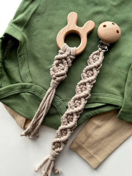 istock Baby clothes, teether and pacifier holder. Handmade. Clothes for baby. ECO accessories 1904099338
