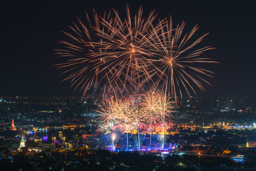 Celebrate New Year's fireworks with skyscrapers along the Chao Phraya River in Bangkok Thailand