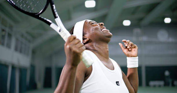 Female tennis player extremely happy about her performance