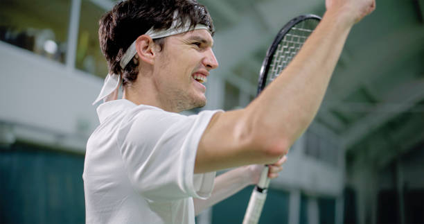 istock Male tennis player happy after succeeding 1904117375