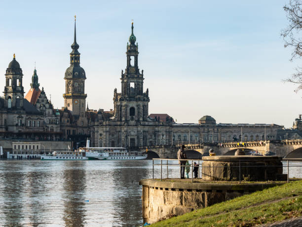 Flooding of the Elbe River in Dresden Dresden, Flooding of the Elbe river with the old town buildings in the background. People are looking at the water. Tourists are surprised about the high water level. elbe river stock pictures, royalty-free photos & images