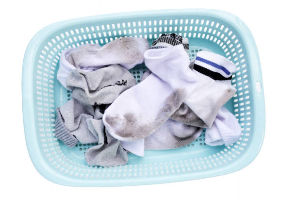 istock Dirty white socks in laundry basket 1904122101